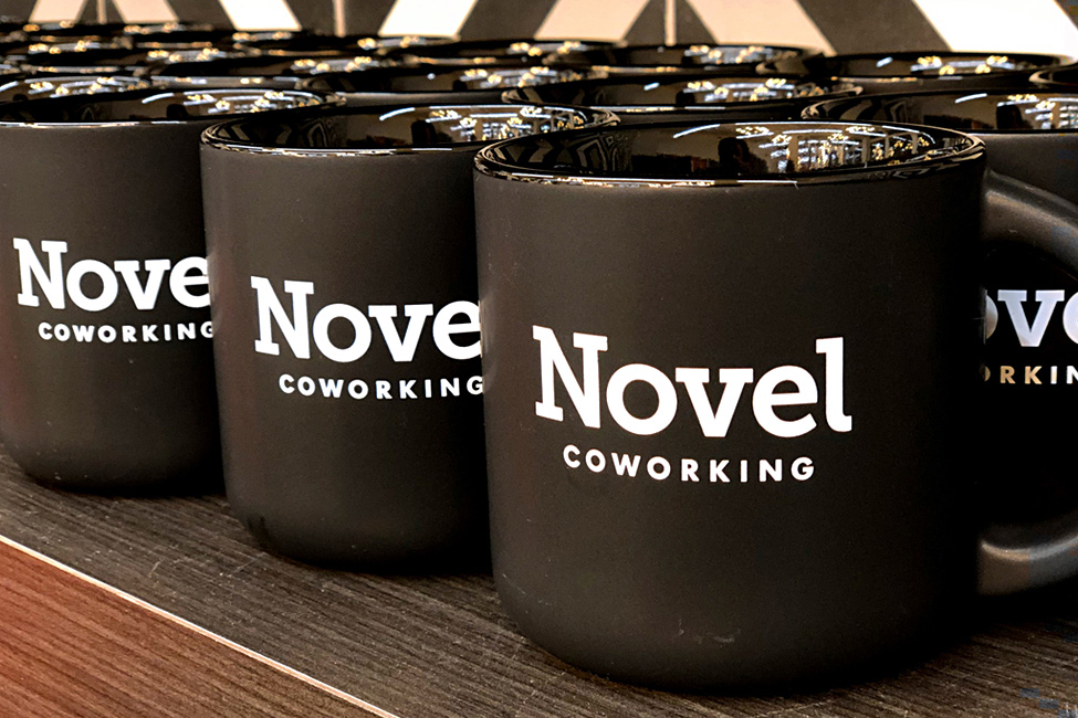 branded mugs in coworking space