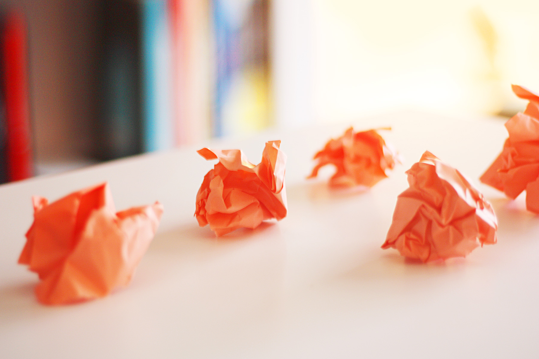 Orange balls of paper symbolizing what it means to be creative