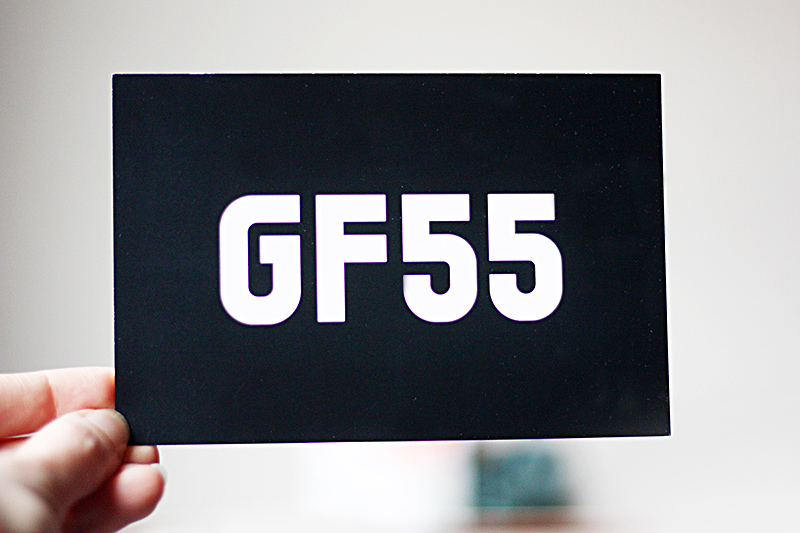GF55 logo postcard