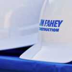 construction company branding on white hardhat