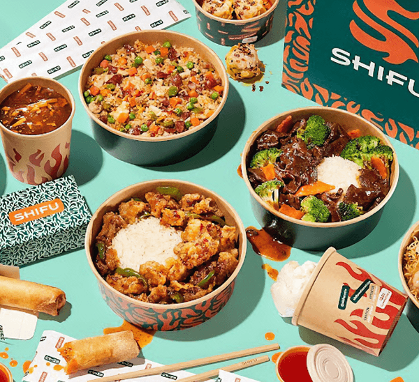 restaurant food packaging and entrees on table