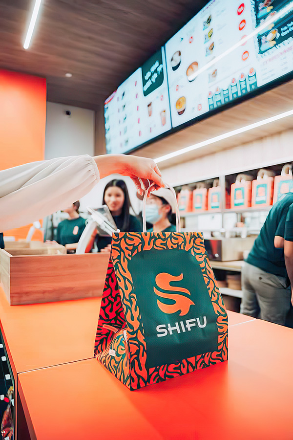 orange and green patterned shopping bag on orange table