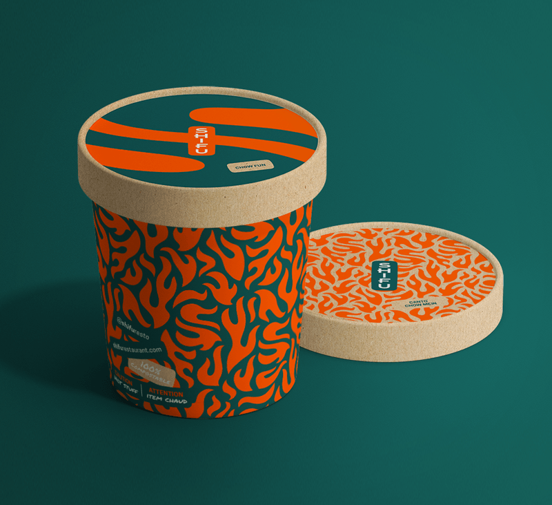 restaurant takeout packaging with brand pattern sitting on green background