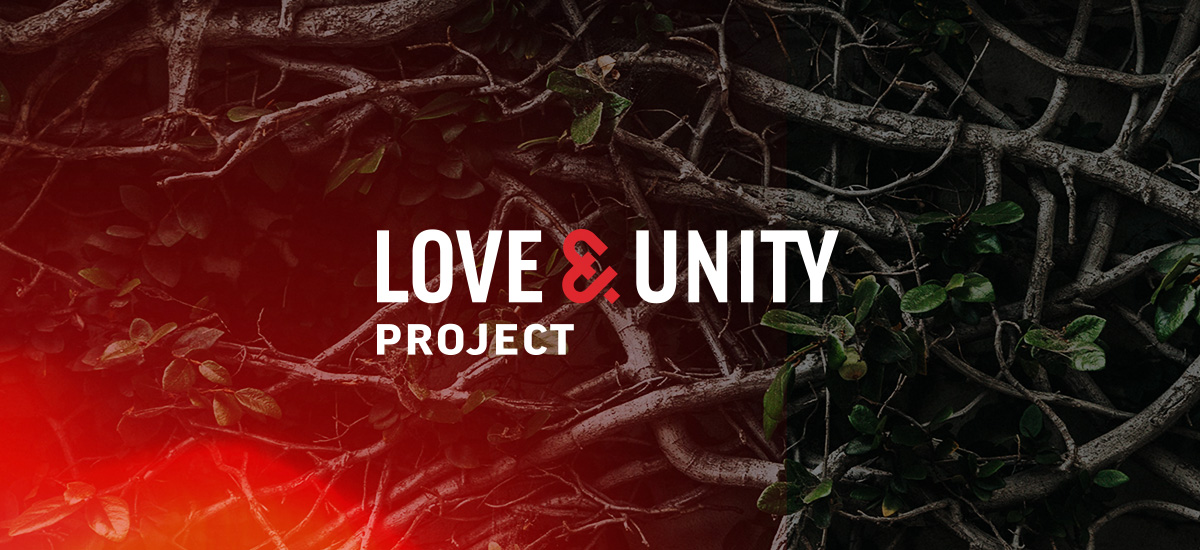 love and unity project logo on background of tree branches