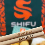 branded chopsticks with logo closeup for chinese fast food restaurant
