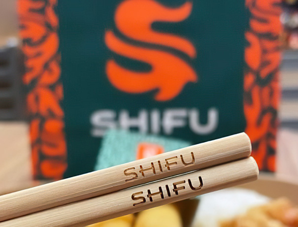branded chopsticks with logo closeup for chinese fast food restaurant